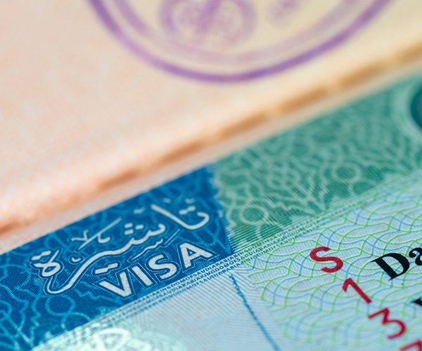 Close-up of Saudi Arabia visa stamp on a passport page.